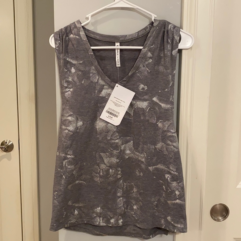 Woman’s Fabletics tank top.